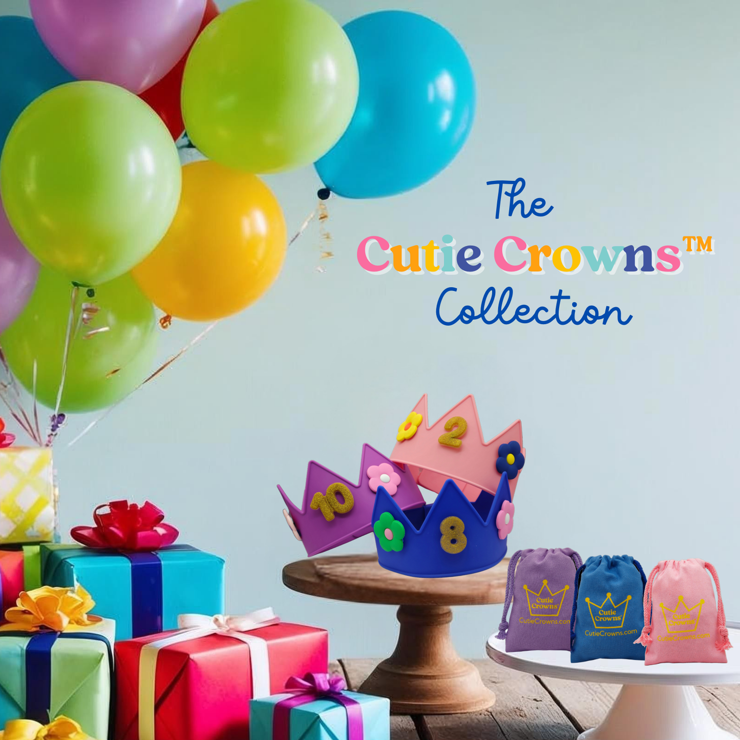 Cutie Crowns Collection. Shows a birthday party table with presents and balloons. Three pink, purple and blue decorated Cutie Crowns with birthday and number charms attached and matching colored canvas gift bags.